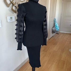 Black mock neck sweater midi dress with sheer sleeves